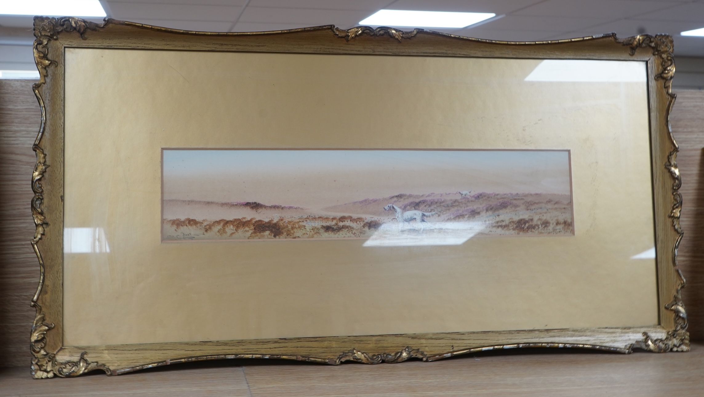 S E Hall (fl. 1910-1930), 'Evening glow, Dartmoor', Gundogs amongst heather, signed and inscribed, watercolour, 10 x 50cm, ornate gilt frame